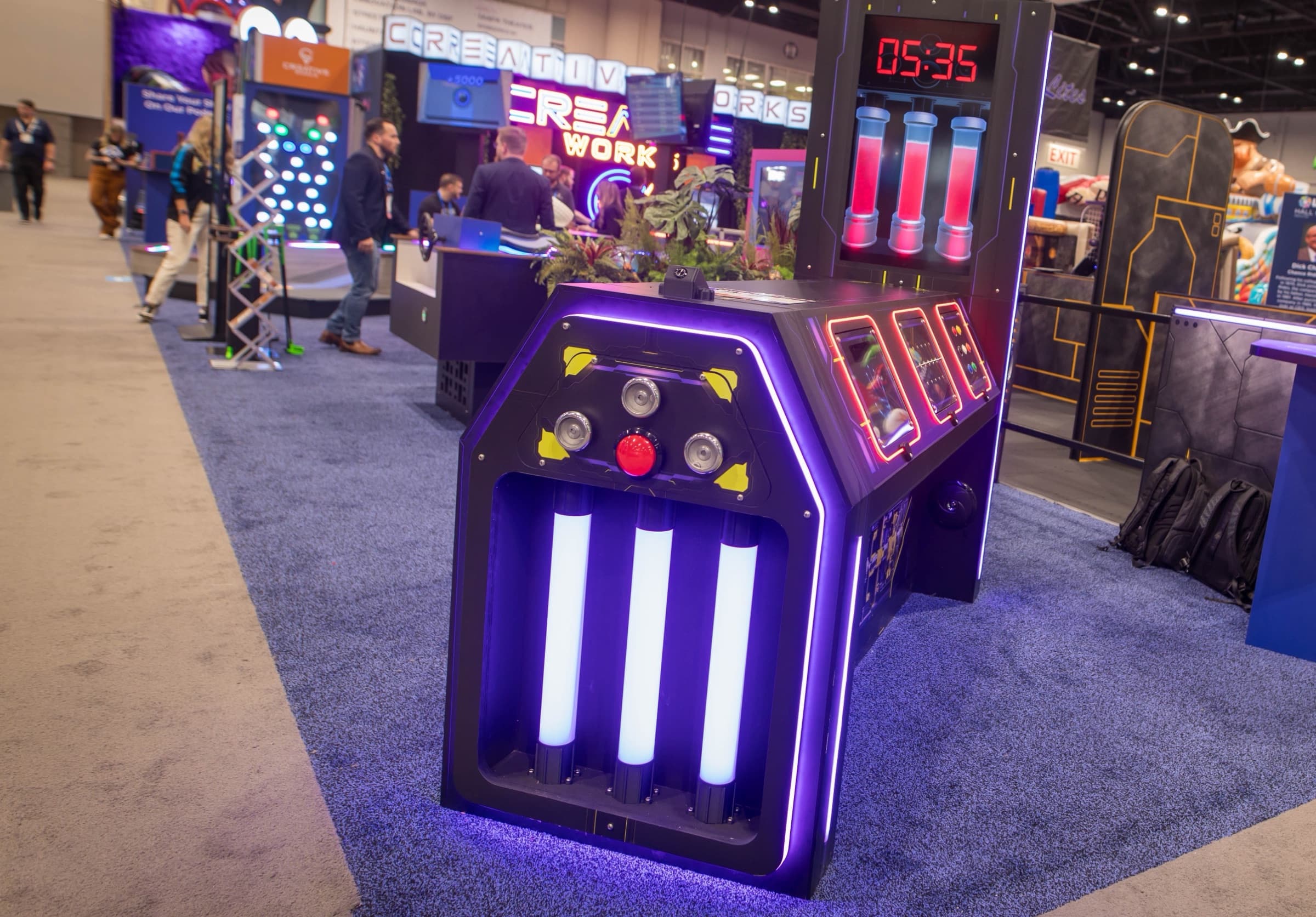 The DETONATE cabinet glowing on the IAAPA 2025 show floor