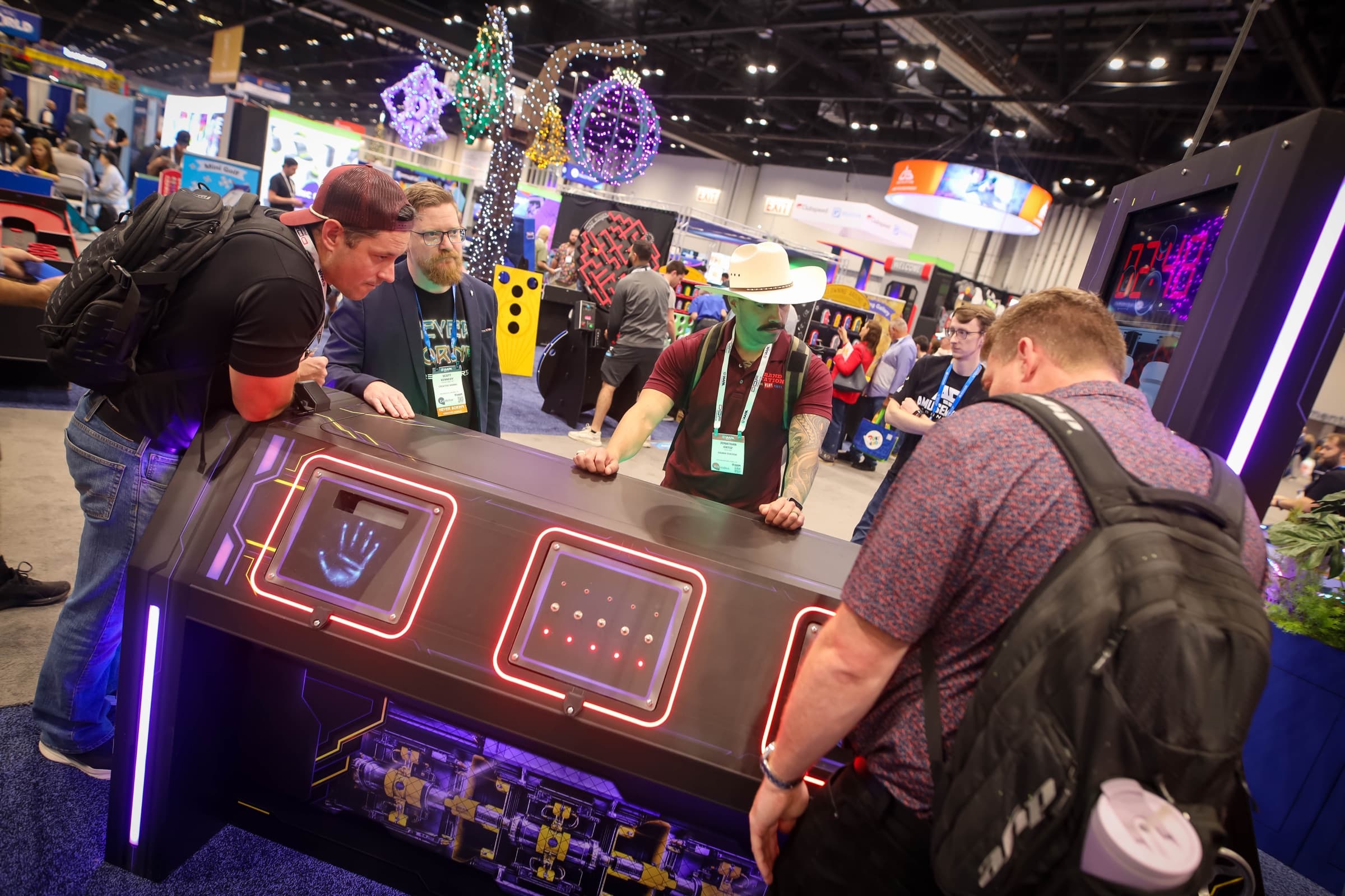 A team crowds around the DETONATE console working the puzzle panels